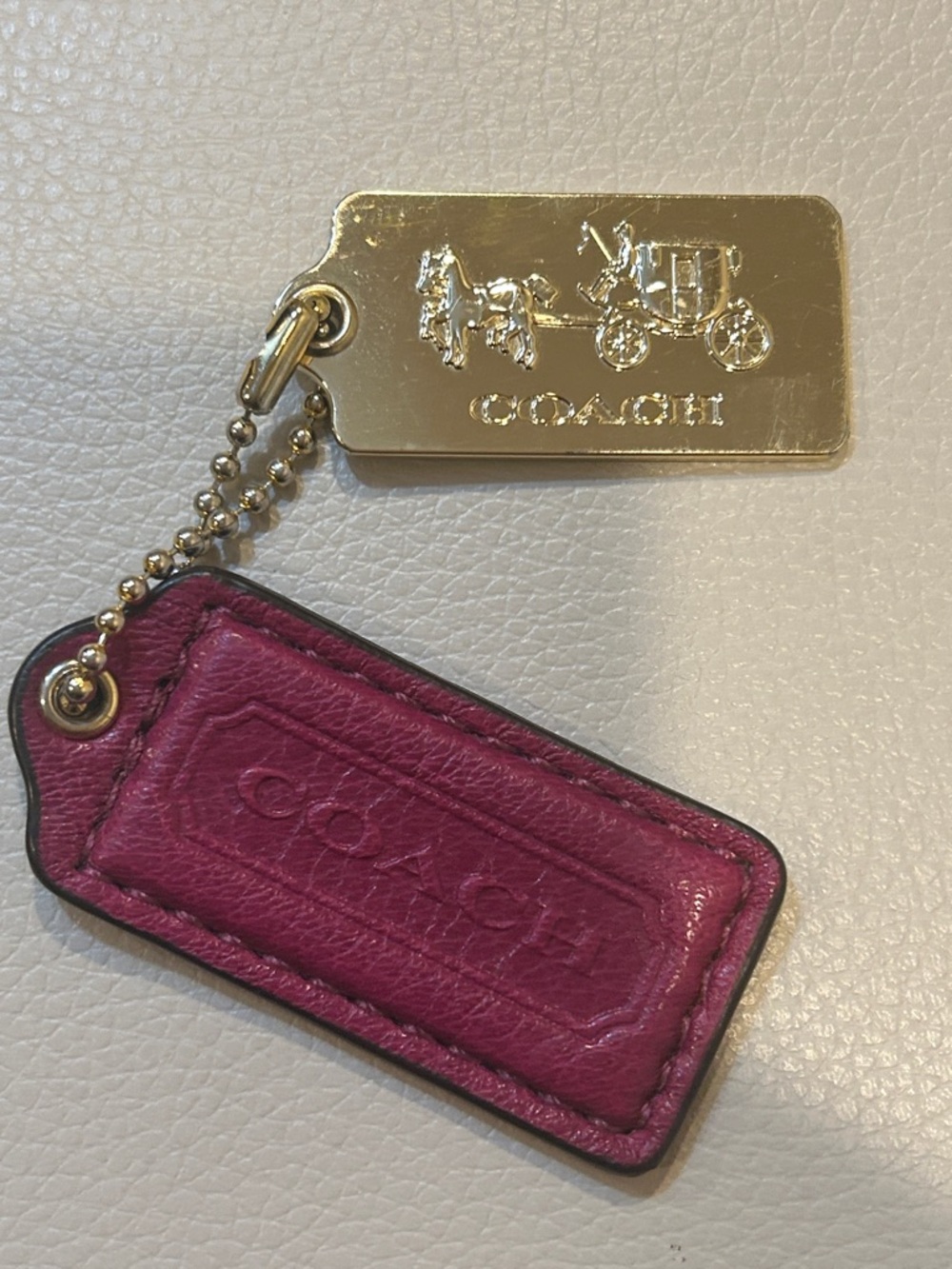 Coach 2.25” Magenta Leather Hang  Tag Charm with Gold Metal Tag